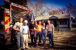 Pictured left to right: Mike Anderson, Chris Mack, John Pettaway, Jesse Baust, Lauren Baust and Shaun Whiteley. The Fighting More Than Fire team helped rebuild Pettaway&apos;s home following a fire.