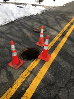 The cause of the explosion was a natural gas buildup in the sanitary sewer from a location remote from the site. The resulting explosion escaped at the weakest point, the manhole covers. The cause of the explosion was a natural gas buildup in the sanitary sewer from a location remote from the site. The resulting explosion escaped at the weakest point, the manhole covers.