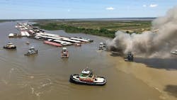 Smoke rises from a barge burning on the Mobile River on Sunday, May 6, 2018. Smoke rises from a barge burning on the Mobile River on Sunday, May 6, 2018.