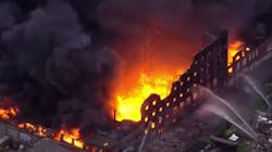 A massive five-alarm fire consumes an unoccupied warehouse in North Philadelphia on Friday, May 18, 2018.