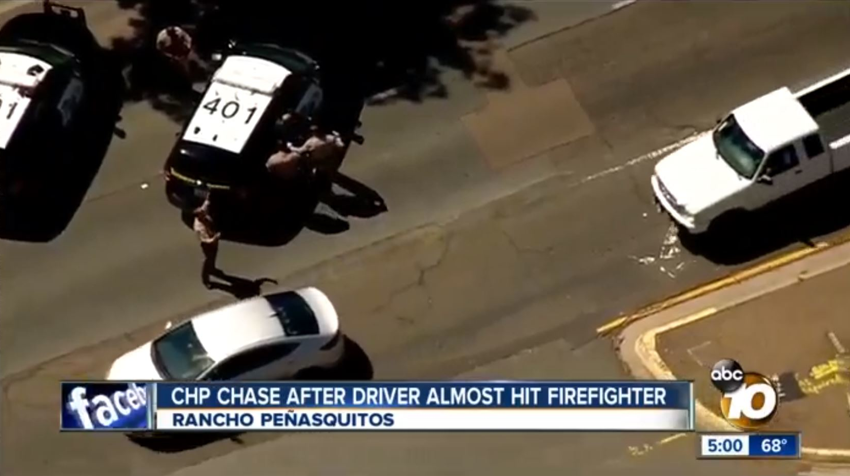California Highway Patrol officers take a man into custody suspected of sparking a brush fire and nearly running over a firefighter in the San Diego area on Monday, May 28, 2018.