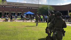 Emergency responders on scene at Santa Fe High School in Santa Fe, TX, after a gunman opened fire on Friday, May 18, 2018, killing at least eight people.