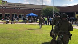Emergency responders on scene at Santa Fe High School in Santa Fe, TX, after a gunman opened fire on Friday, May 18, 2018, killing at least eight people.