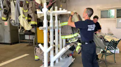 Laundered pieces of turnout gear are hung on a rack designed by a Toledo, OH, firefighter to speed up drying time and encourage colleagues to more frequently wash their gear.