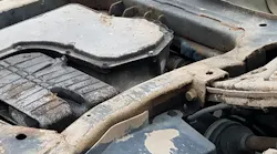 Air chisels can be used successfully to gain entry to the vehicle in difficult to access positions. Here the student is using the air chisel to cut the outer skin of the door to gain access to the hinges on the overturned vehicle.