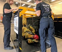 A teenager makes her way through an entanglement course. A teenager makes her way through an entanglement course.