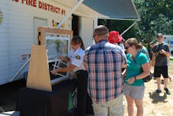 The author talks with residents about window fall safety in multiple dwellings. The author talks with residents about window fall safety in multiple dwellings.