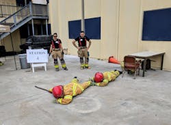 Search and rescue: Teens practice crawling and swinging a tool in front of them to look for possible victims. Search and rescue: Teens practice crawling and swinging a tool in front of them to look for possible victims.