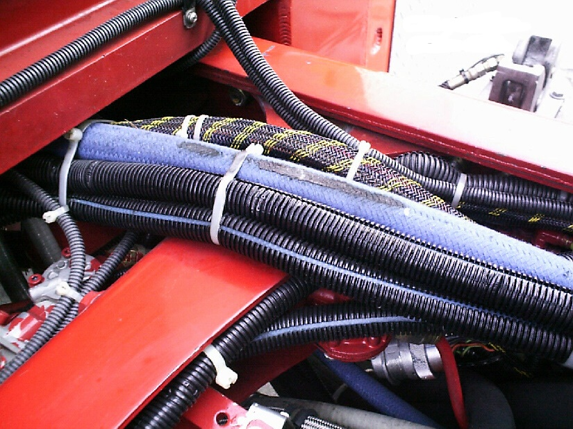 The inspection team should be looking for potential future problems. In this case, the cab was pinching the electrical wiring and the hydraulic lines against the frame cross member.