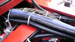 The inspection team should be looking for potential future problems. In this case, the cab was pinching the electrical wiring and the hydraulic lines against the frame cross member.