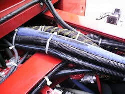 The inspection team should be looking for potential future problems. In this case, the cab was pinching the electrical wiring and the hydraulic lines against the frame cross member. The inspection team should be looking for potential future problems. In this case, the cab was pinching the electrical wiring and the hydraulic lines against the frame cross member.