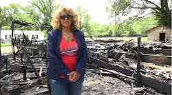 Alorton Mayor Joann Reed stands near the mobile home that was destroyed by fire.