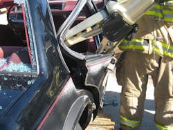 Photo 8: Extrication scenes may require tool operations in compromised positions. Drills should include the use of the tools in varying positions to understand their capabilities. Photo 8: Extrication scenes may require tool operations in compromised positions. Drills should include the use of the tools in varying positions to understand their capabilities.