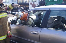 Proper tool placement for the vertical displacement. Note that the tool is in the rear one-third of the door, the bottom arm is angled out, and the tips are sitting on the window frame. Proper tool placement for the vertical displacement. Note that the tool is in the rear one-third of the door, the bottom arm is angled out, and the tips are sitting on the window frame.