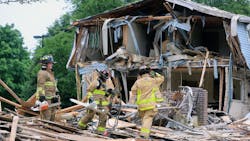 Columbus firefighters on scene after a suspected natural gas explosion leveled a duplex on Friday, June 22, 2018.