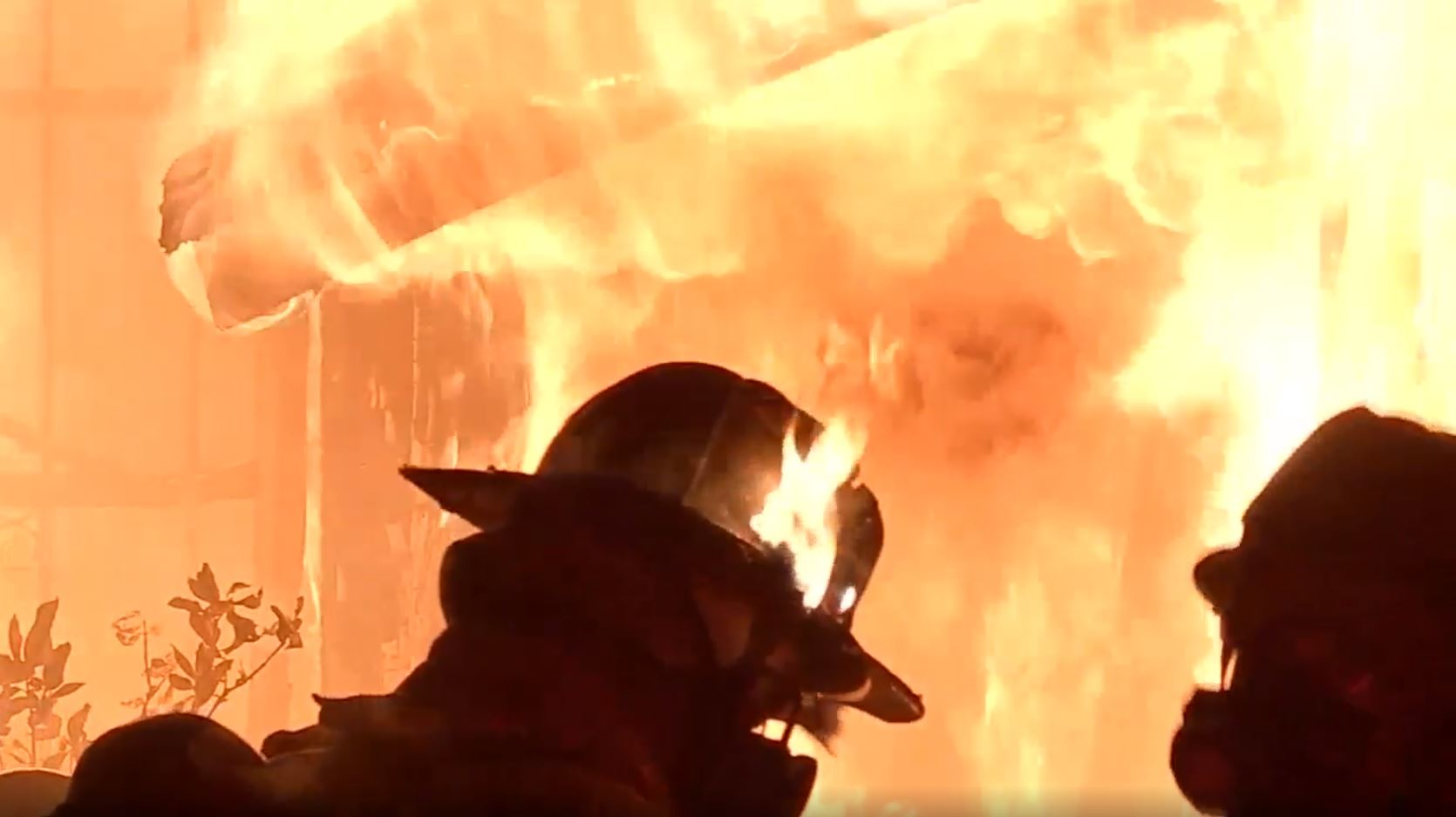 The heat was so intense during a suspicious fire in Houston on Thursday, June 21, 2018, that a firefighter's helmet caught fire.