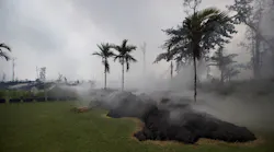 Lava flows inside the Leilani Estates neighborhood on the Big Island in Hawaii on May 10, 2018.
