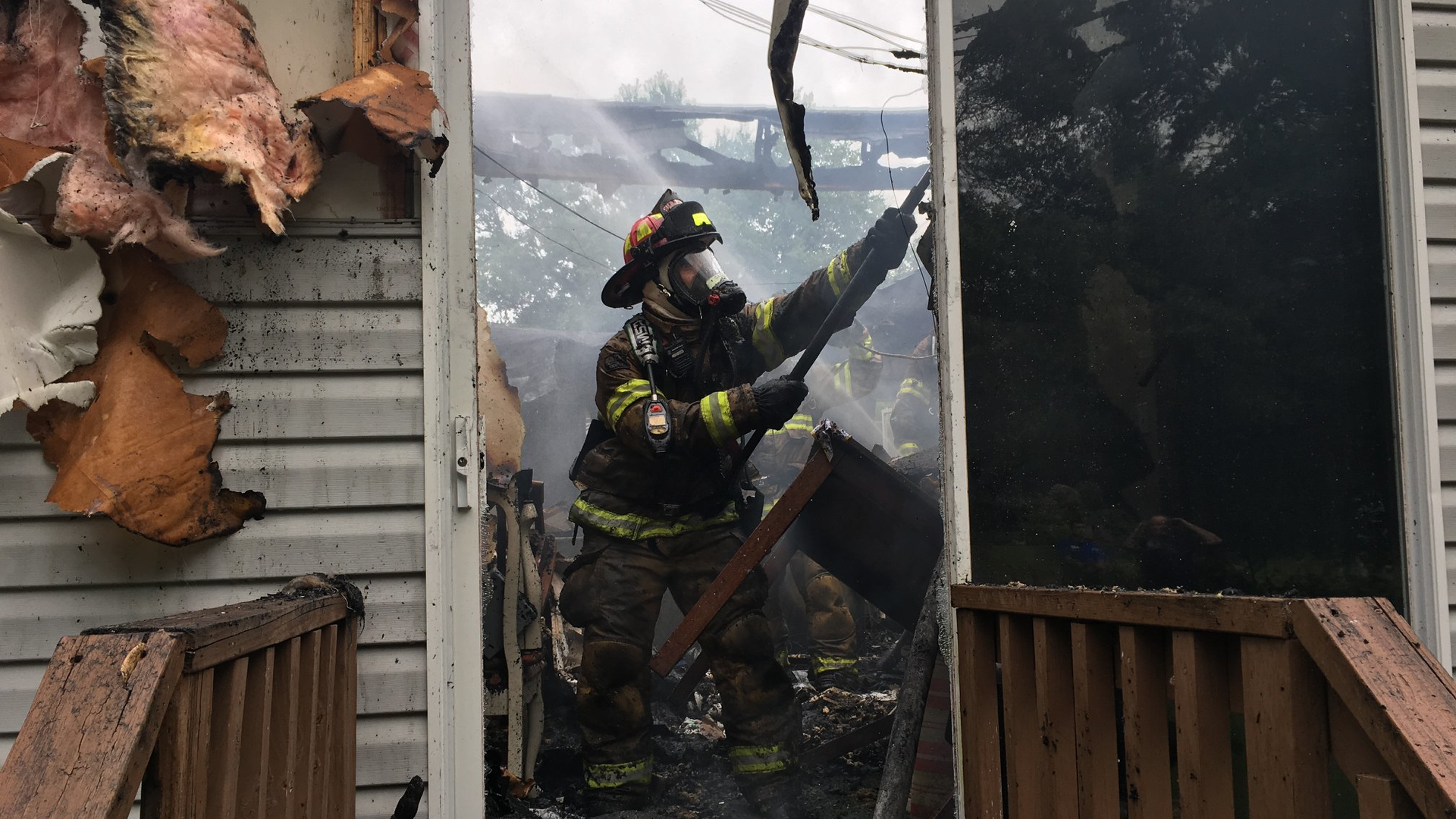 Marion County Capt. Daniel Garcia performs overhaul at a mobile home fire in Summerfield, FL, on May 14, 2018.