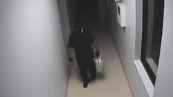 Surveillance video shows a man wearing a ski mask carrying a weed sprayer full of flammable liquid as he walks through the Vigo County Corrections building in Terre Haute, IN, on Wednesday, June 27, 2018. Surveillance video shows a man wearing a ski mask carrying a weed sprayer full of flammable liquid as he walks through the Vigo County Corrections building in Terre Haute, IN, on Wednesday, June 27, 2018.