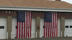 The Morris Volunteer Fire Department has American flags draped over its apparatus bay doors after members voted on June 19, 2018, to cease providing services on June 30.