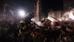 FDNY firefighters from Staten Island&apos;s Rescue 5 search for victims in the &apos;pile&apos; at Ground Zero in December 2001.