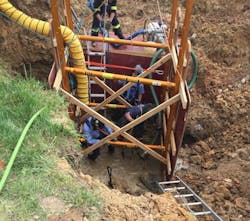 Special Ops crew members with the Baltimore Fire Department digging into a collapsed trench to locate a worker who was found dead 10 hours after rescue efforts began on Tuesday, June 5, 2018. Special Ops crew members with the Baltimore Fire Department digging into a collapsed trench to locate a worker who was found dead 10 hours after rescue efforts began on Tuesday, June 5, 2018.