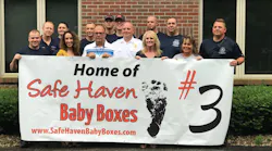 Decatur Township firefighters pose for photos after it was announced on June 21, 2018, that their station would install a 'Safe Haven Baby Box.'