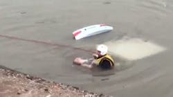 A rescue diver brings a woman to the surface after her car plunged into a canal in Mesa, AZ, on Monday, July 9, 2018. A rescue diver brings a woman to the surface after her car plunged into a canal in Mesa, AZ, on Monday, July 9, 2018.