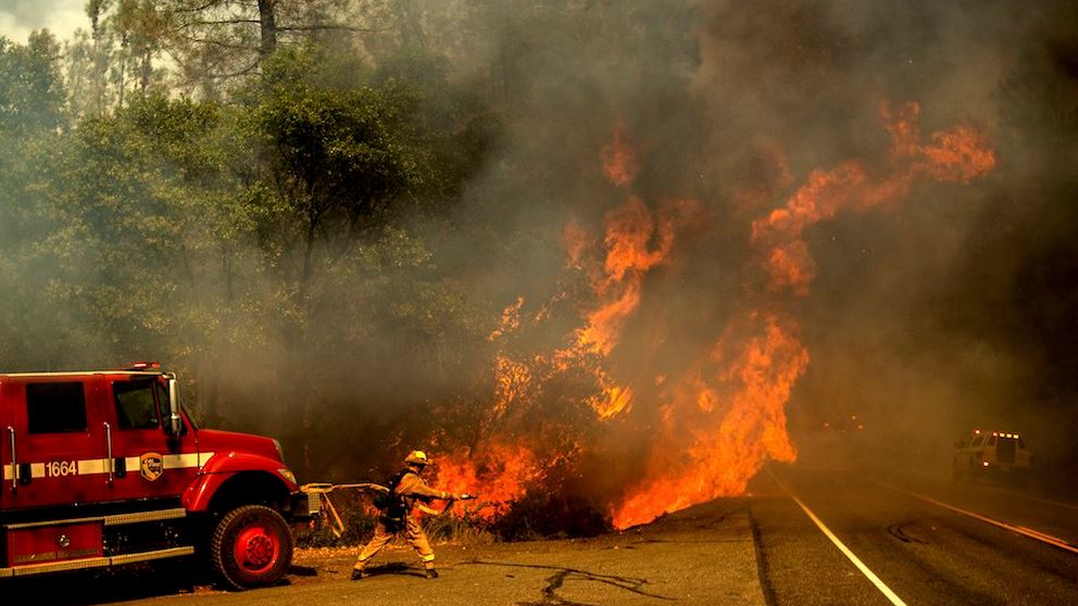 A firefighter tackling a portion of the Carr Fire near Redding, CA, on Thursday, July 26, 2018.