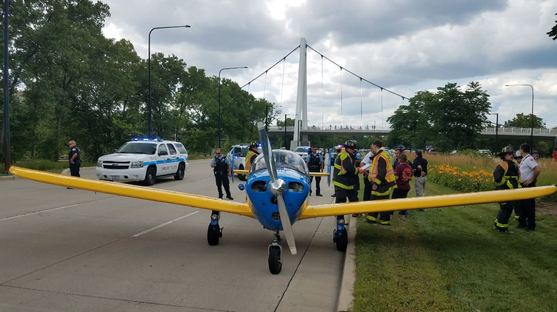 A small plane sits on South Lake Shore Drive in Chicago after making a safe emergency landing when it couldn't reach Midway Airport on Friday, July 27, 2018.