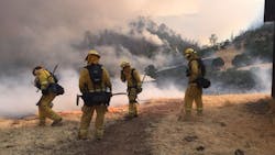 Firefighters work on a containment line against the County Fire in Yolo County, CA, on Sunday, July 1, 2018. Firefighters work on a containment line against the County Fire in Yolo County, CA, on Sunday, July 1, 2018.