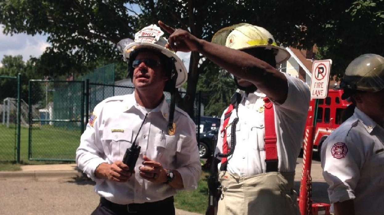 St. Paul Assistant Fire Chief Mike Gaede, left, during the response to a fatal explosion at Minnehaha Academy in Minneapolis on Aug. 2, 2017.