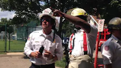 St. Paul Assistant Fire Chief Mike Gaede, left, during the response to a fatal explosion at Minnehaha Academy in Minneapolis on Aug. 2, 2017.
