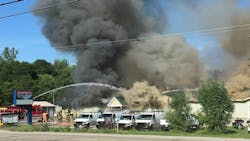 Firefighters battling a blaze that engulfed a Twin Lake, MI, gun shop on Wednesday, July 25, 2018. Firefighters battling a blaze that engulfed a Twin Lake, MI, gun shop on Wednesday, July 25, 2018.