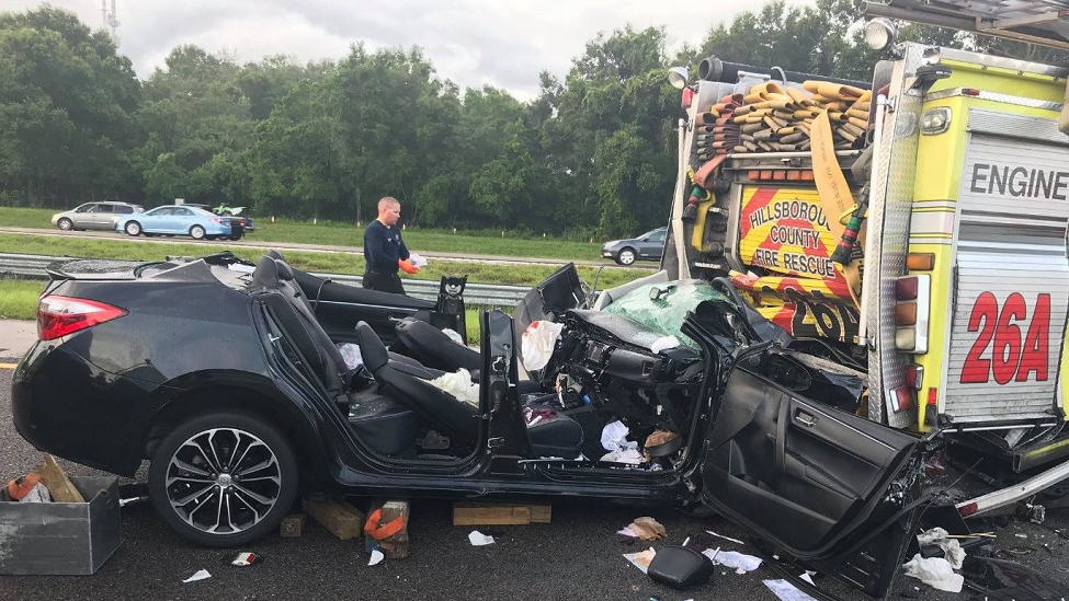 A vehicle sits mangled after firefighters extracted the injured driver, who slammed into the back of their engine as they were responding to another wreck on Saturday, July 21, 2018.