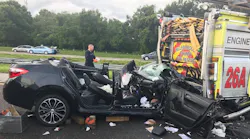 A vehicle sits mangled after firefighters extracted the injured driver, who slammed into the back of their engine as they were responding to another wreck on Saturday, July 21, 2018.