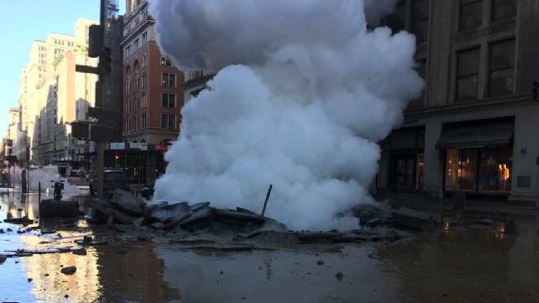 Steam rises after a pipe exploded on Fifth Avenue between 20th and 21st streets in Manhattan on Thursday, July 9, 2018.