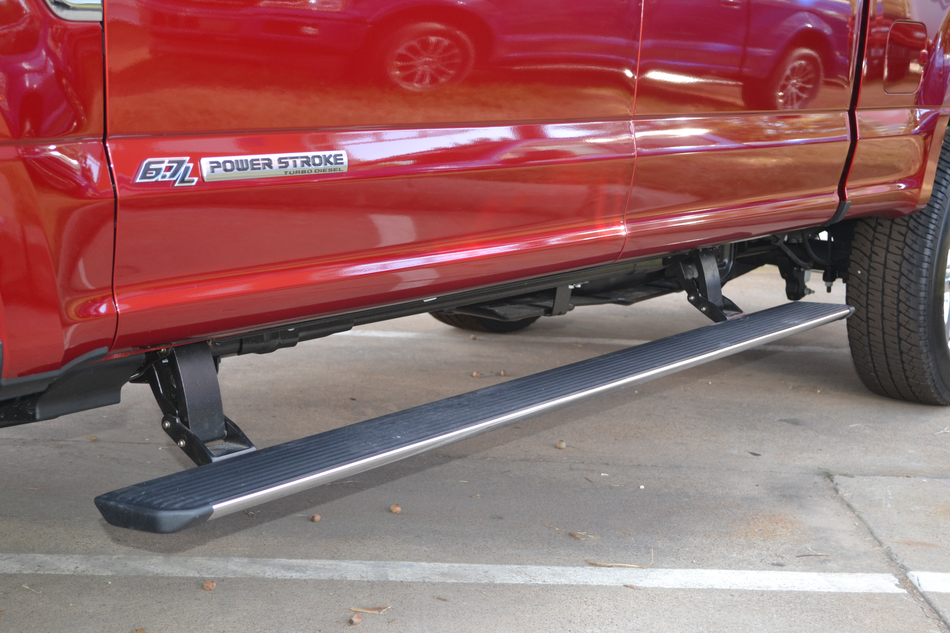 This lightweight, deployable running board, found on a 2018 Ford F-350, folds up underneath the vehicle when it is being driven and deploys to this position as passengers get in or out of the truck. It will not adequately support the weight of the truck so this running board should be not be used for stabilization. Photos by Ron Moore