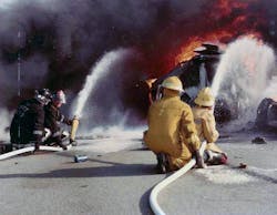 Early Martin County hazmat personnel applying foam on a flammable liquid tanker fire.