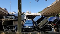 Cars sit piled on top of each other after the upper section of a parking garage in Irving, TX, collapsed on Tuesday, July 31, 2018. Cars sit piled on top of each other after the upper section of a parking garage in Irving, TX, collapsed on Tuesday, July 31, 2018.