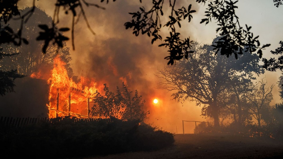 A home near Hendricks Road is engulfed in flames as the River Fire spreads near Lakeport, CA, on Tuesday, July 31, 2018.