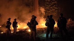 Firefighters conducting overnight operations against the Carr Fire in Shasta County, CA, on Thursday, Aug. 16, 2018.