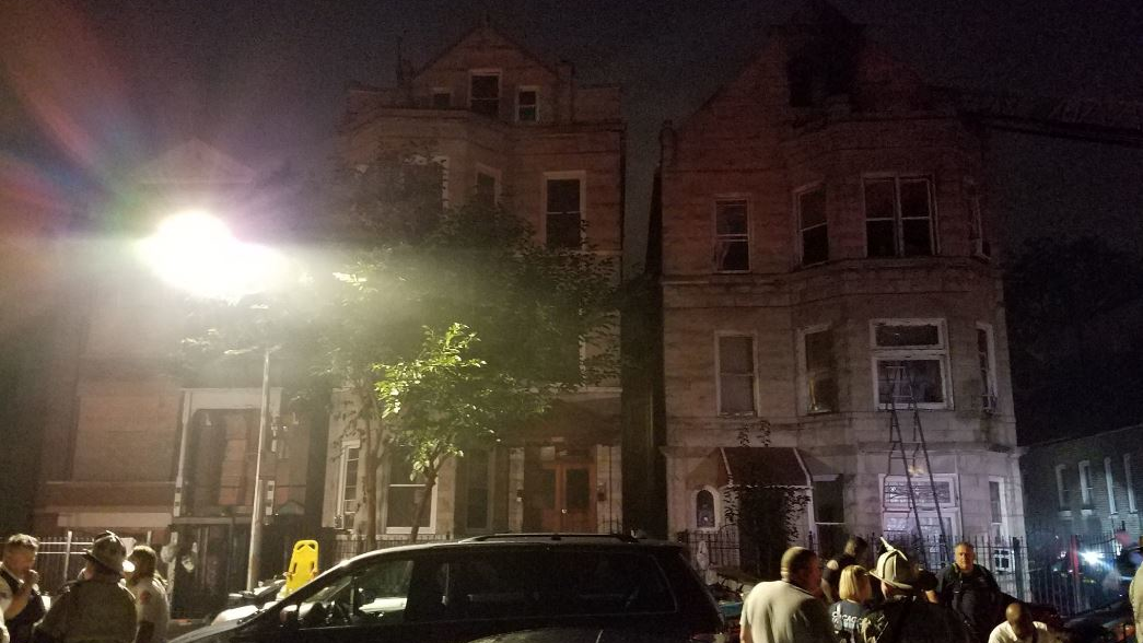 First responders on scene after an apartment fire killed eight people in Chicago's Little Village neighborhood on Sunday, Aug. 26, 2018.