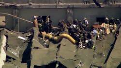 Chicago firefighters remove an injured person after an explosion caused the roof to collapse at the Calumet Water Reclamation Plant on the city's Far South Side on Wednesday, Aug. 30, 2018. Chicago firefighters remove an injured person after an explosion caused the roof to collapse at the Calumet Water Reclamation Plant on the city's Far South Side on Wednesday, Aug. 30, 2018.