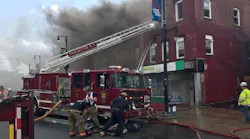 Syracuse firefighters on scene during an apartment building fire on Wednesday, Aug. 29, 2018.