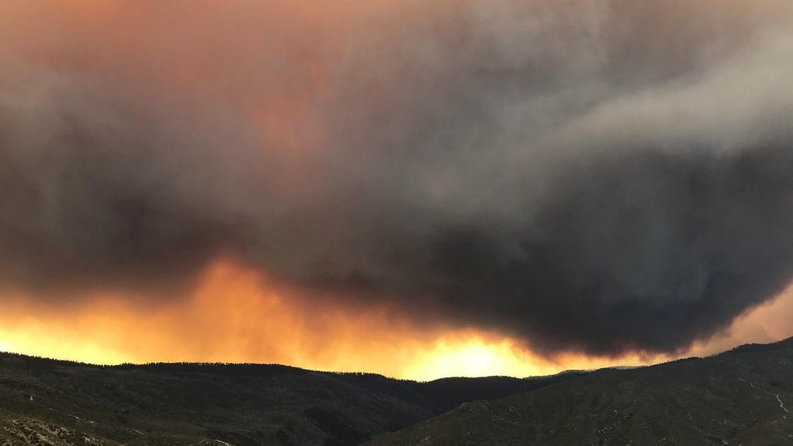 A massive cloud of smoke hovers over the Mendocino Complex Fire on Tuesday, Aug. 14, 2018.
