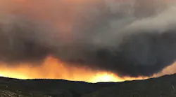 A massive cloud of smoke hovers over the Mendocino Complex Fire on Tuesday, Aug. 14, 2018.