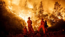 Firefighters monitor a burn operation on top of a ridge near the town of Ladoga, CA, on Aug. 7, 2018. Firefighters monitor a burn operation on top of a ridge near the town of Ladoga, CA, on Aug. 7, 2018.