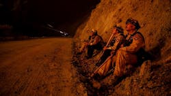 Firefighters monitor a burn operation on top of a ridge near the town of Ladoga, CA, on Aug. 7, 2018. Firefighters monitor a burn operation on top of a ridge near the town of Ladoga, CA, on Aug. 7, 2018.
