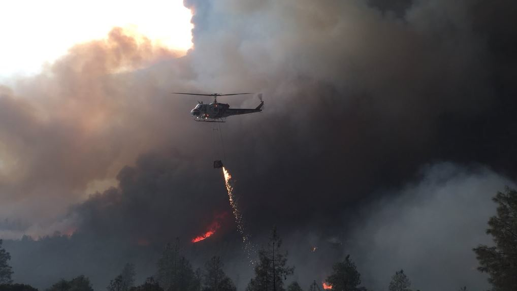 A firefighting helicopter during operations against the Mendocino Complex Fire on Sunday, Aug. 26, 2018.